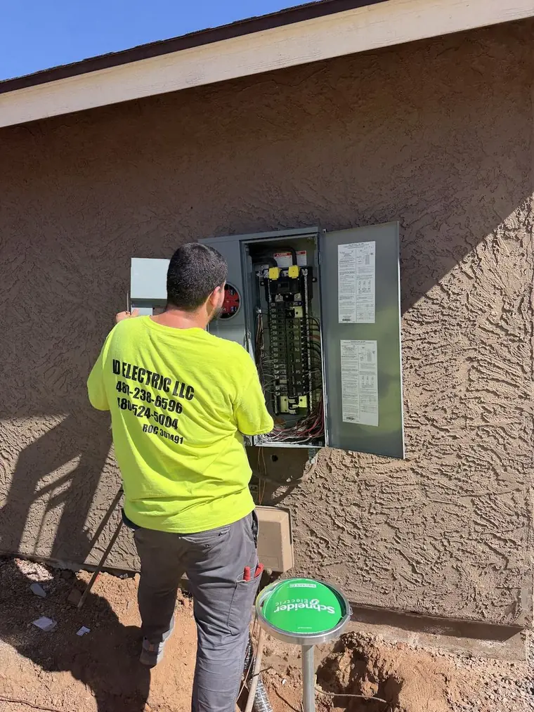 Electrician working on an electrical panel
